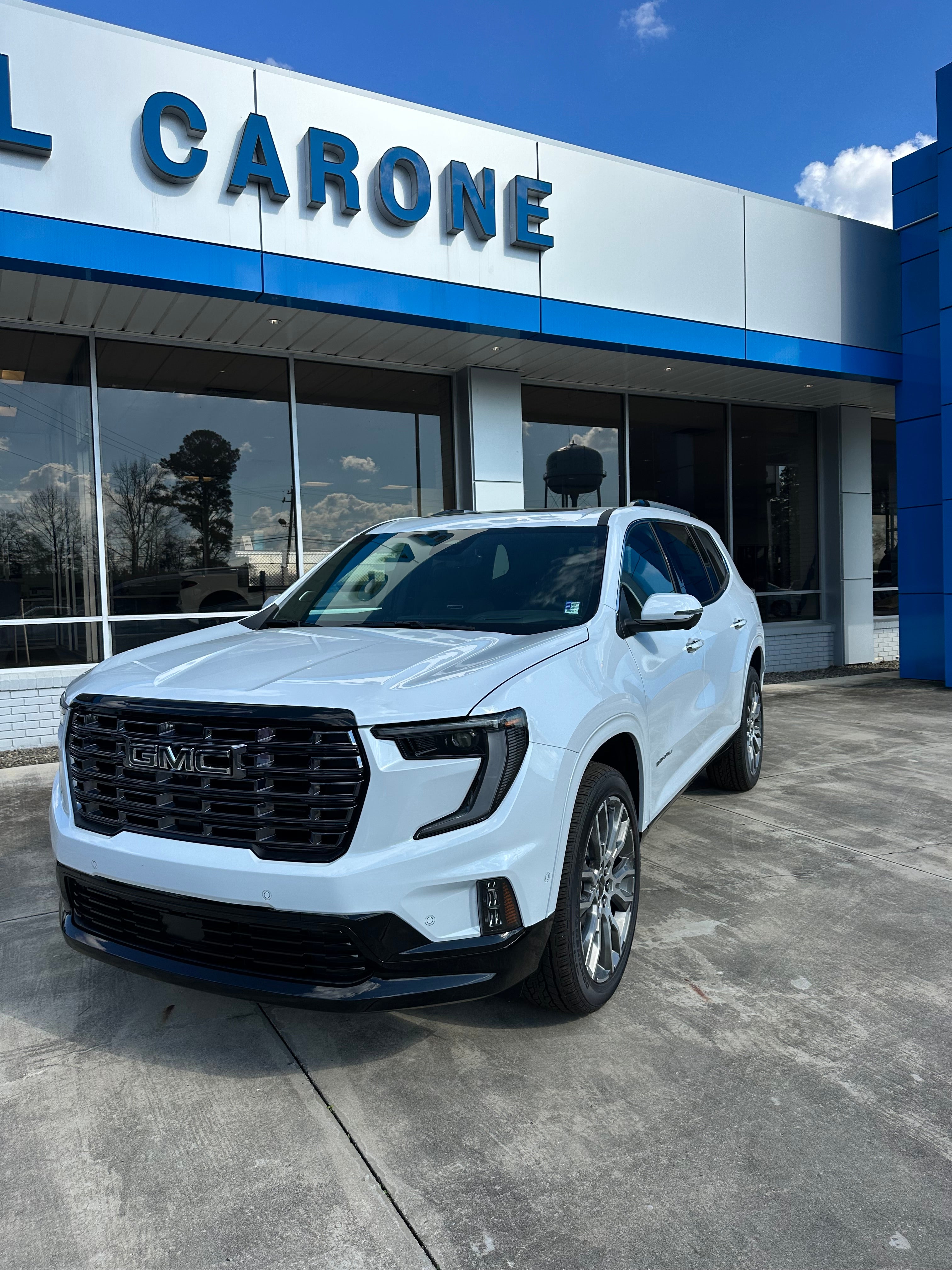 2026 GMC Acadia Denali Ultimate in Glacier White Tricoat — front three-quarter view