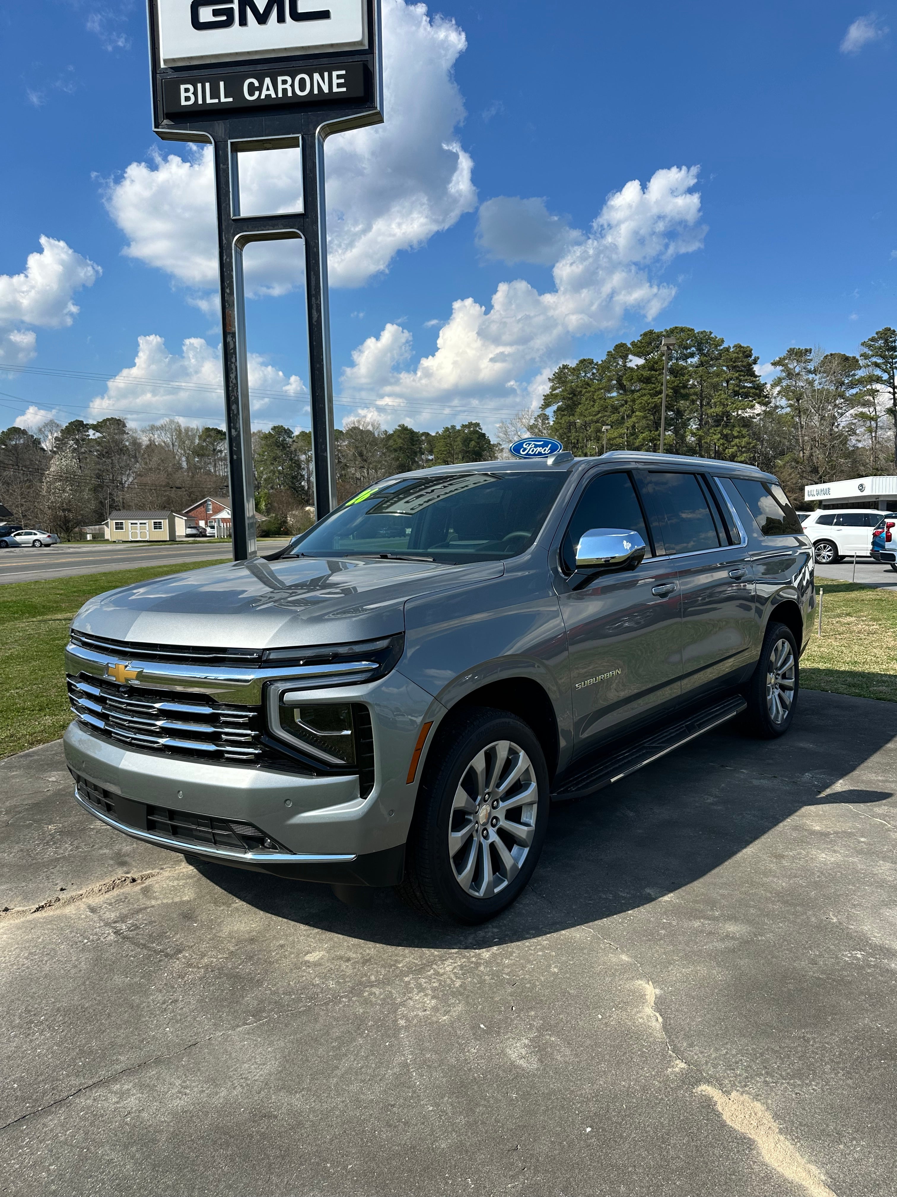 2026 Chevrolet Suburban Premier in Sterling Gray Metallic — front three-quarter view