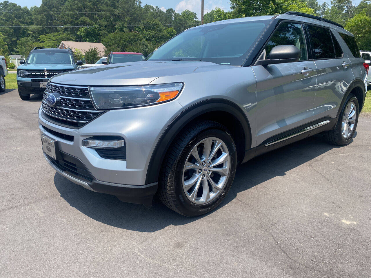 2020 Ford Explorer XLT AWD 4dr SUV in Iconic Silver — front three-quarter view